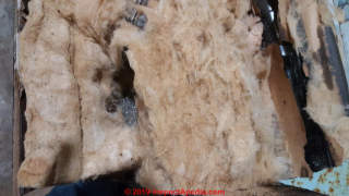 Fiberglass insulation in an old Ben Hur freezer (C) Inspectapedia.com