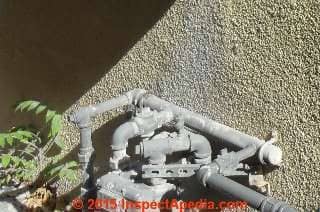 Clothes dryer vent blows lint on gas meter (C) InspectAPedia.com
