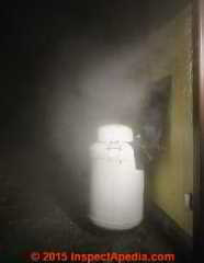 Dryer exhaust blowing moisture and lint near an LP gas tank regulator assembly (C) Daniel Friedman