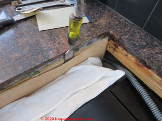 Removing a slice of plywood to make the cooktop fit with adequate clearance (C) Daniel Friedman
