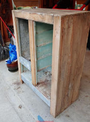 Wooden ice box from 1900s might use asbestos insulation or liner (C) InspectApedia.com Sherry Noland