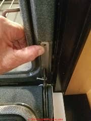 Jenn air oven door retaining clip removal (C) Daniel Friedman at InspectApedia.com