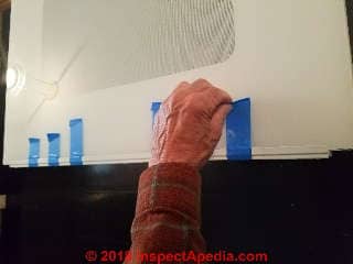 Remove remaining masking tape from the oven door glass (C) Daniel Friedman InspectApedia.com
