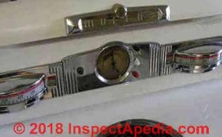 Detail of 1950's Moffat stove top logo & clock - at InspectApedia.com