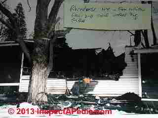 Fire damaged home - electrical cord under carpet (C) Daniel Friedman