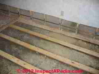 Floor removed and lower drywall removed in a flooded basement to allow dryout (C) Daniel Friedman