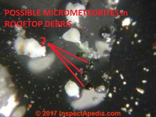 Top lit closeup of small roof debris particles, possible micrometeorites (C) Daniel Friedman at InspectApedia.com