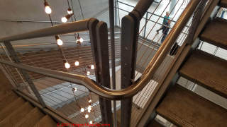 Curve handrail provides contiuity around corner and landing on a stairway - Whitney Museum (C) Daniel Friedman
