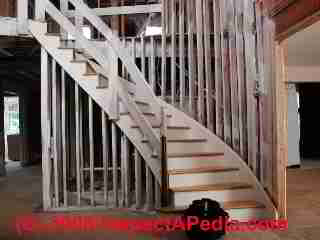 Photo of a stairwell and entry floor of a home following demolition and cleaning for flood and mold damage (C) Daniel Friedman