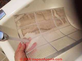Washing the air filter for a split system air conditioner (C) Daniel Friedman at InspectApedia.com