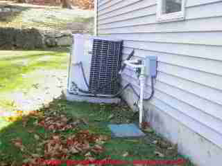 Photograph of air conditioning compressor condenser units with many problems