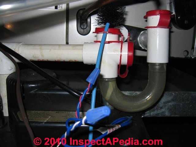 Snake the clogged A/C condensate line carefully using a condensate drain 