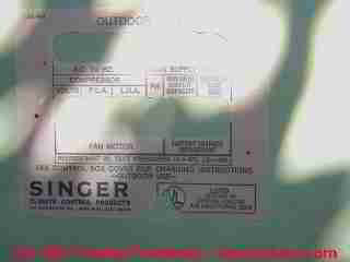 Photograph of a modified air conditioning system information data tag - hiding info