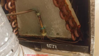 Repair for leaky Janitrol Amana AC unit condensate (C) Inspectapedia.com Richard