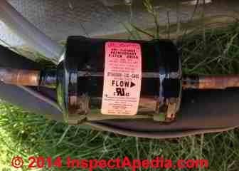Refrigerant filter drier canister on new KeepRite air conditioner installation but TEV was jammed (C) InspectAPedia ET