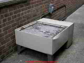 Photograph of  This old compressor was used as a seat by workers eating lunch behind
a law office.