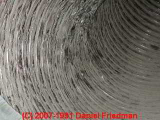 Photo of normal gray dirt and debris inside of flex duct (C) Daniel Friedman