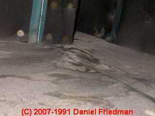 Photograph of water damaged fiberglass HVAC duct lining