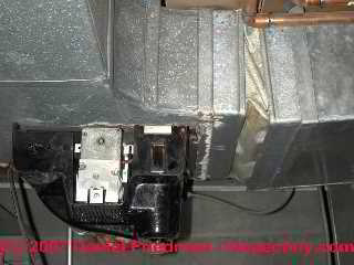 Photograph of asbestos fabric on an air conditioning and heating blower vibration damper