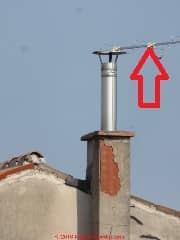 Antenna supported by chimney is not proper nor safe (C) Daniel Friedman at Inspectapedia.com photo: Padova Italy by DJF