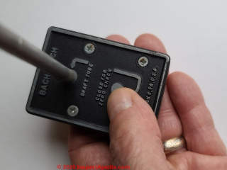 Bachrach Draft-Rite draft meauring tool with the zeroing hole covered to zero the instrument (C) Daniel Friedman at InspectApedia.com