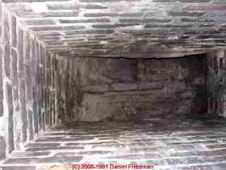 Unlined unsafe brick chimney flue interior view (C) Daniel Friedman