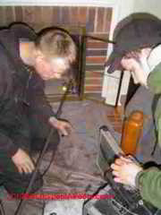 Preparing to inspect a chimney flue with a camera (C) Daniel Friedman
