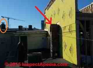 Nearby building requires chimney height extension (C) InspectApedia NAF