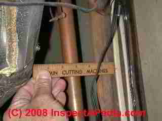 Inadequate fire clearance flue to wood (C) Daniel Friedman