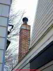Rust damaged chimney cap & rain cap (C) Daniel Friedman
