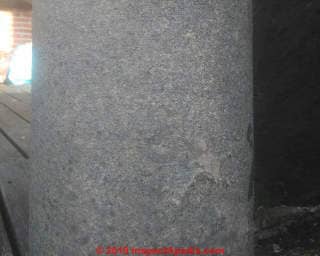 Transite cement asbestos pipe at an apartment (C) InspectApedia.com Daniel