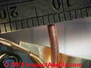 Close-up measurement of the diameter of a #14 copper electrical wire (C) Daniel Friedman