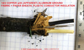Copper electrical wire conductors with an aluminum ground in fabric sheathing (C) InspectApedia.com Aronstein Farrell 