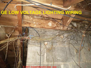 Rat's nest of low-voltage wiring at a GE Low Voltage Lighting System in an older home (C) InspectApedia.com Don