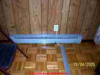 Proper eletrical outlet location over heating baseboards (C) Carson Dunlop