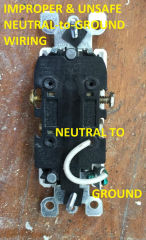 Improper & unsafe electrial receptacle wiring: neutral connected to ground screw (C) InspectApedia.com Jaco
