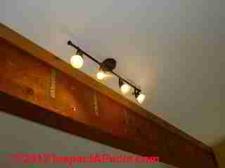 Line voltage track lights in a home (C) Daniel Friedman at InspectApedia.com