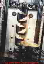 Photograph of  photos of unsafe electrical circuit breaker burning up in the electric panel