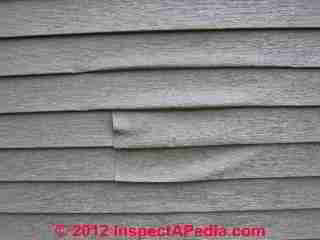 BBQ heat damaged vinyl siding (C) Daniel Friedman