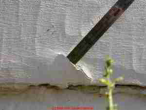 Photo of paint failure due to inappropriate use of skim coat with crack filler