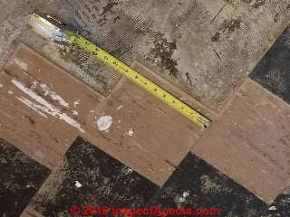 Asbestos-containing 9x9" floor tiles from a 1950's home (C) InspectAPedia.com W