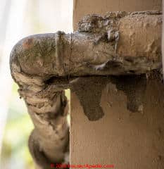 Asbestos suspect pipe insulation and lagging in rough shape (C) InspectApedia.com Antonio
