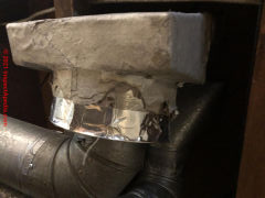 Asbestos paper wrap on duct register exterior (C) InspectApedia.com