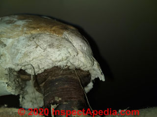 Asbestos pipe insulation (C) InspectApedia.com Mark