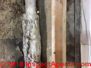 Asbestos suspect material needs testing (C) InspectApedia.com Nick