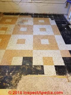 Asbestos-suspect cork pattern vinyl floor tile (C) Inspectapedia.com Mark
