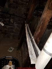 Corrugated asbestos paper insulation on steam pipes in a Gramercy Park NY apartment (C) Daniel Friedman