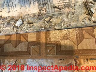 Thin vinyl floor tile, brown parquet pattern (C) InspectApedia.com Burke