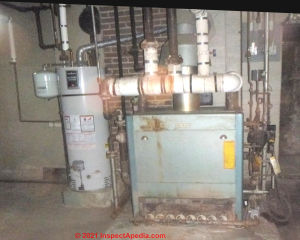Weil McLain 2 pipe steam heat gas fired boiler in a 1920s home (C) InspectApedia.com TransueL