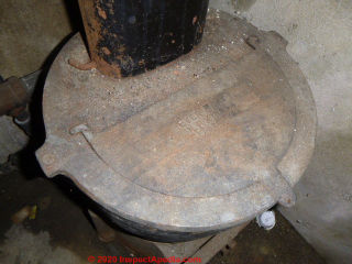 Small coal fired boiler expansion tank in a Pennsylvania grage (C) InspectApedia.com Lawrence Transue